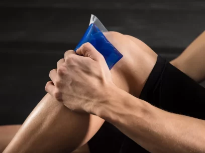 Cold therapy being applied to a male knee after a sports injury