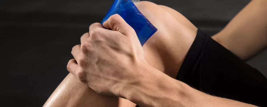 Cold therapy being applied to a male knee after a sports injury